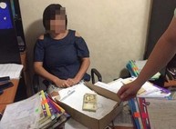 В Харькове майор полиции за взятки раздавала разрешение не оружие (ФОТО)